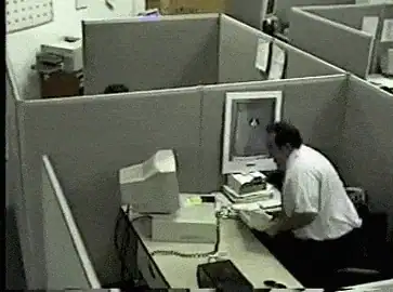 Office worker smashing his computer monitor in a fit of rage